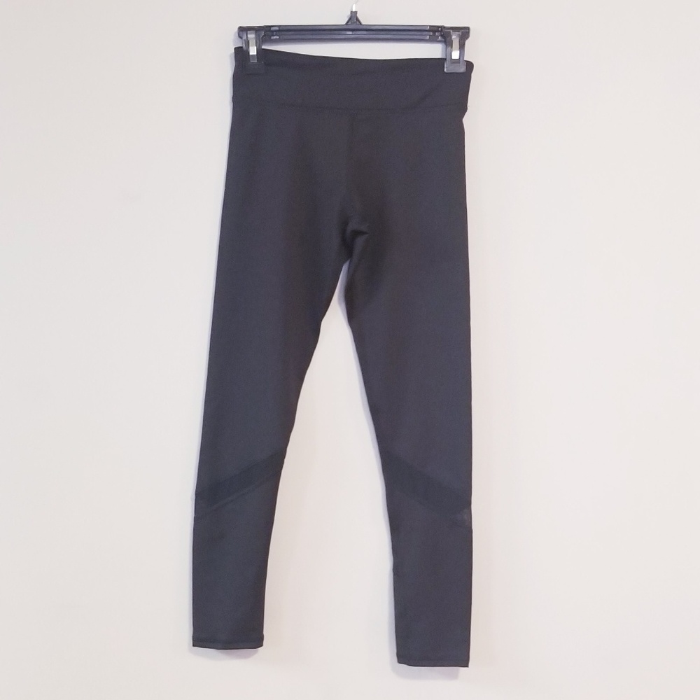Black legging with see through strip on calf.